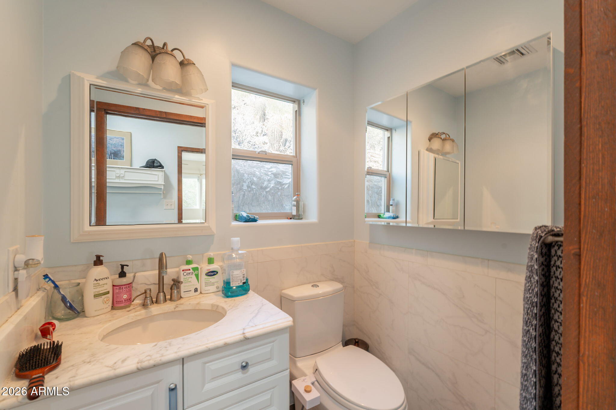 1902 East Cortez Street Phoenix, AZ 85020 - Photo 36 of 60 a bathroom with a granite countertop toilet sink and mirror