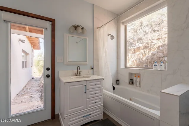 a bed room with a bed and a television