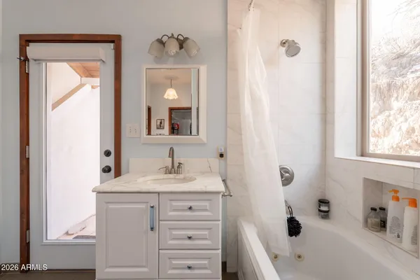 a bathroom with a shower curtain and a toilet