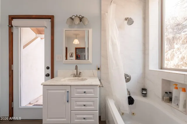a bathroom with a shower curtain and a toilet