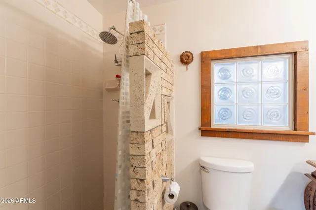 a bedroom with furniture and a window