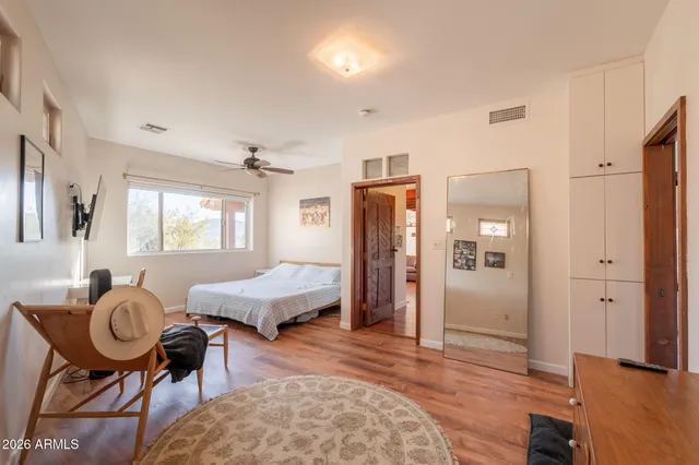 a view of a dry yard with mountains in the background
