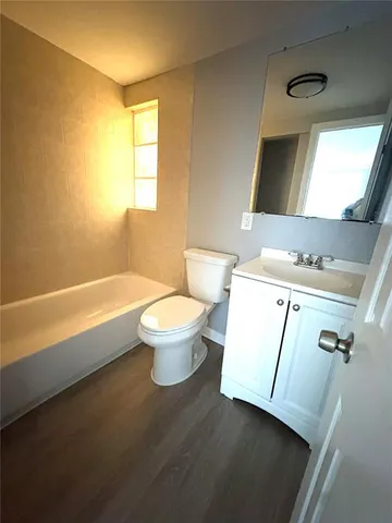a bathroom with a sink a toilet and a bathtub