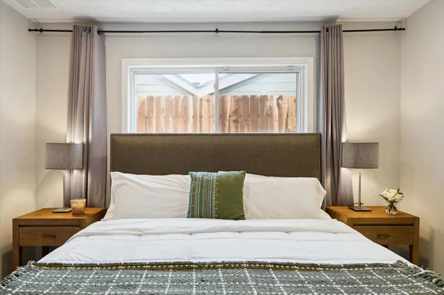 a bedroom with a bed and window