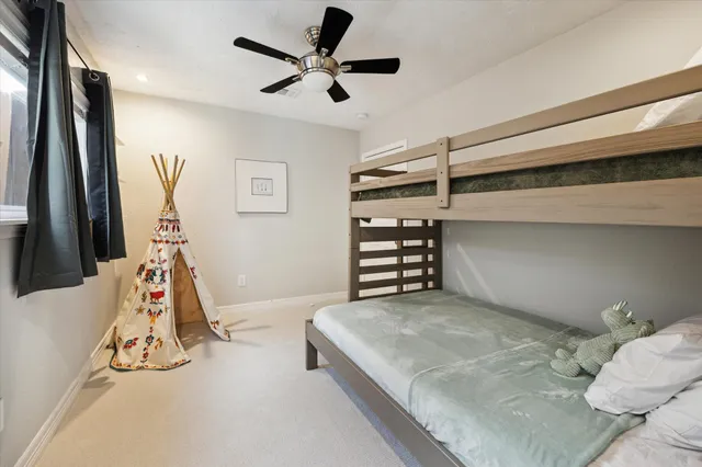 a bedroom with furniture and a window