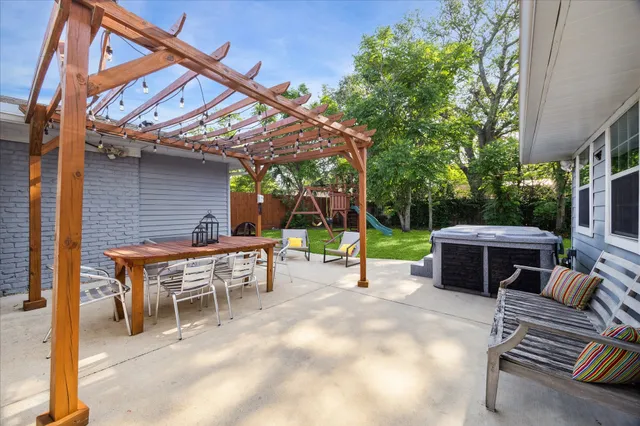 a view of a patio with a table and chairs