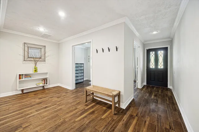 a view of a livingroom with furniture and wooden floor