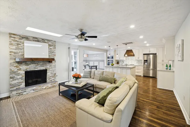 a living room with furniture and a fireplace
