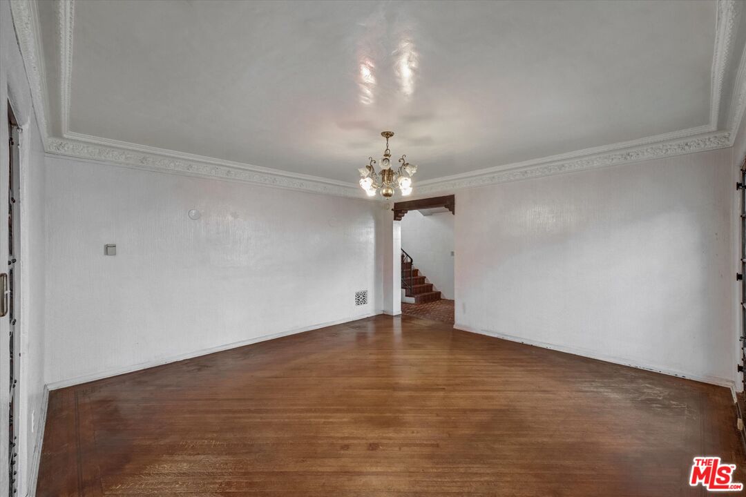 6220 Warner Drive Los Angeles, CA 90048 - Photo 15 of 44 a view of an empty room with a chandelier fan