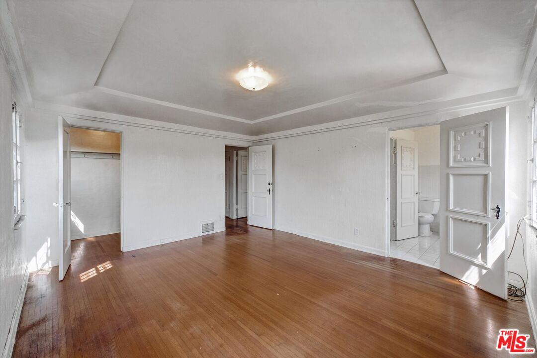 6220 Warner Drive Los Angeles, CA 90048 - Photo 33 of 44 a view of an empty room with wooden floor and closet