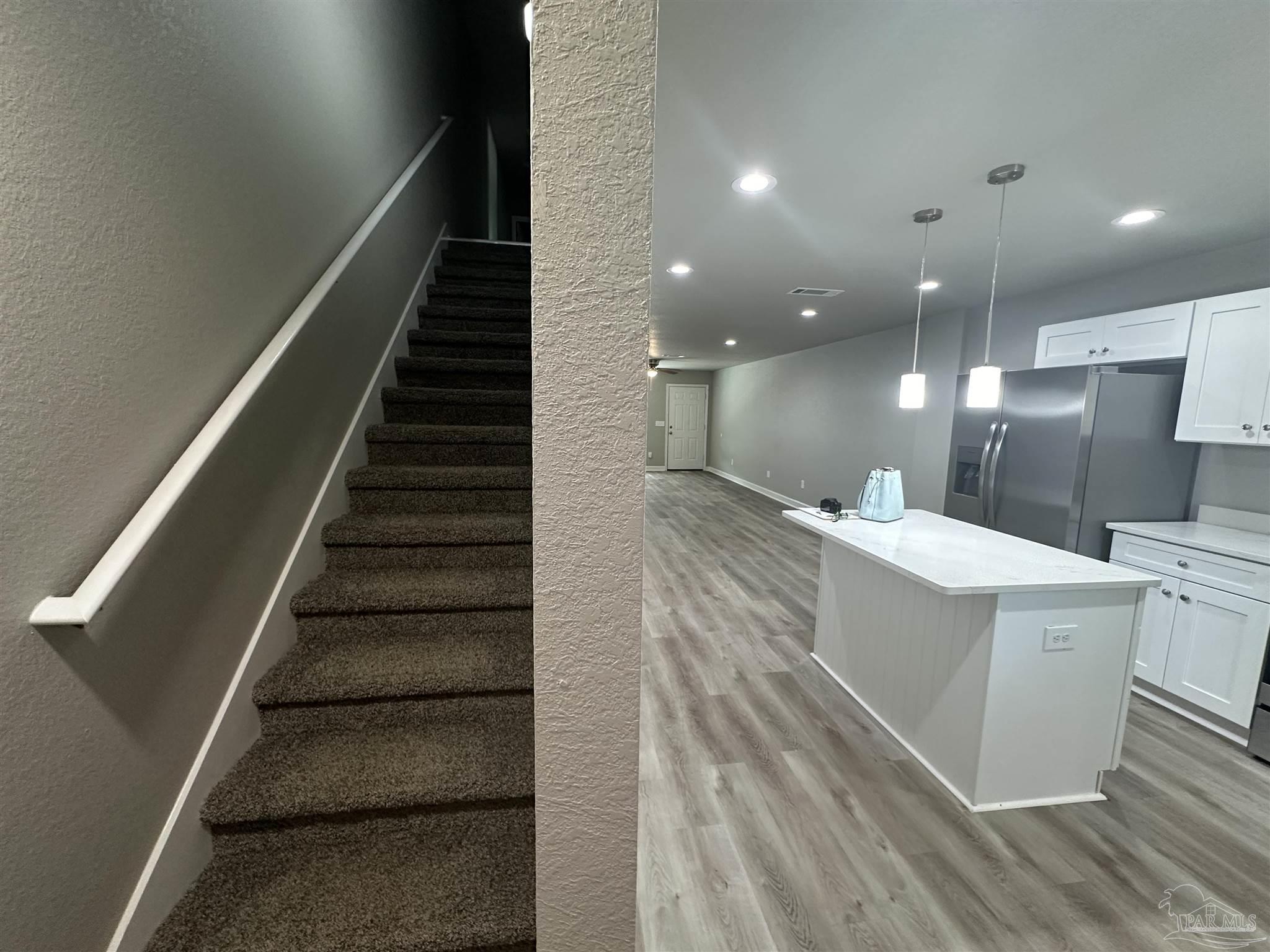 9906 Holsberry Road, Unit 101 Pensacola, FL 32534 - Photo 7 of 16 a view of kitchen with sink and refrigerator