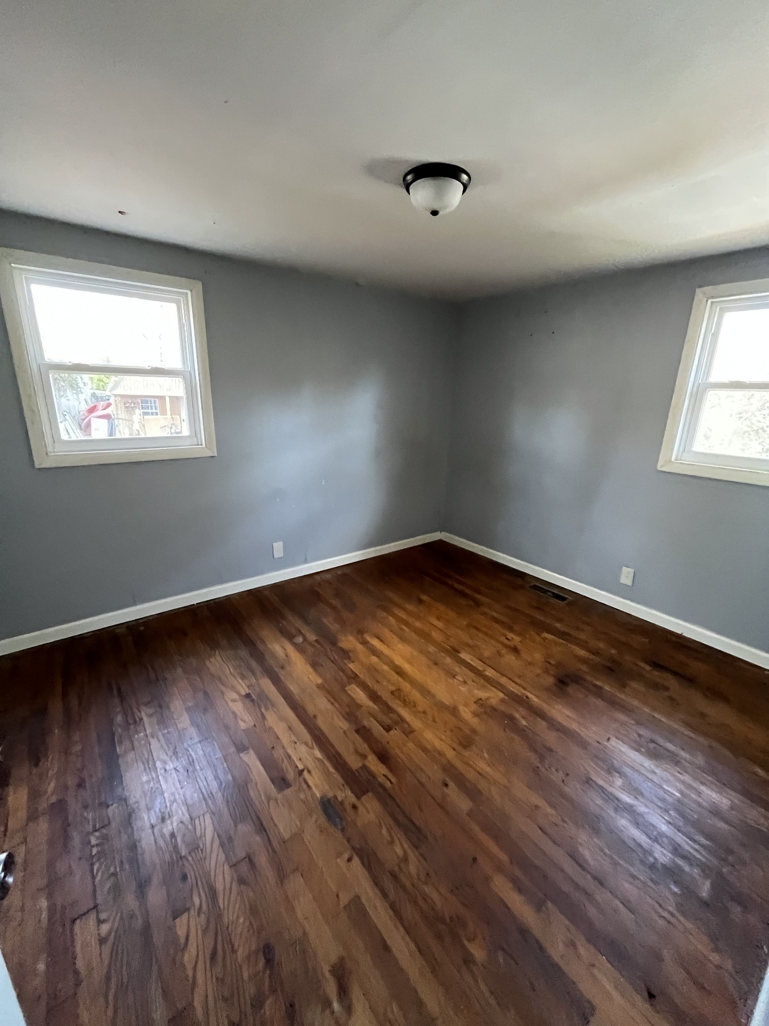 540 Austin Branch Road Portland, TN 37148 - Photo 6 of 8 an empty room with wooden floor and windows