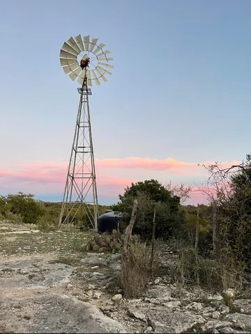 a ocean view with a mountain in the background