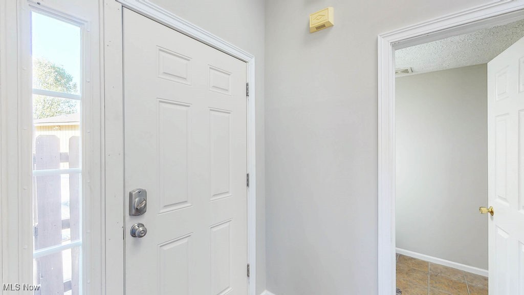 1426 Loop Road, Unit 1426 Kent, OH 44240 - Photo 2 of 40 Entrance foyer with light wood finished floors, vaulted ceiling, and a skylight