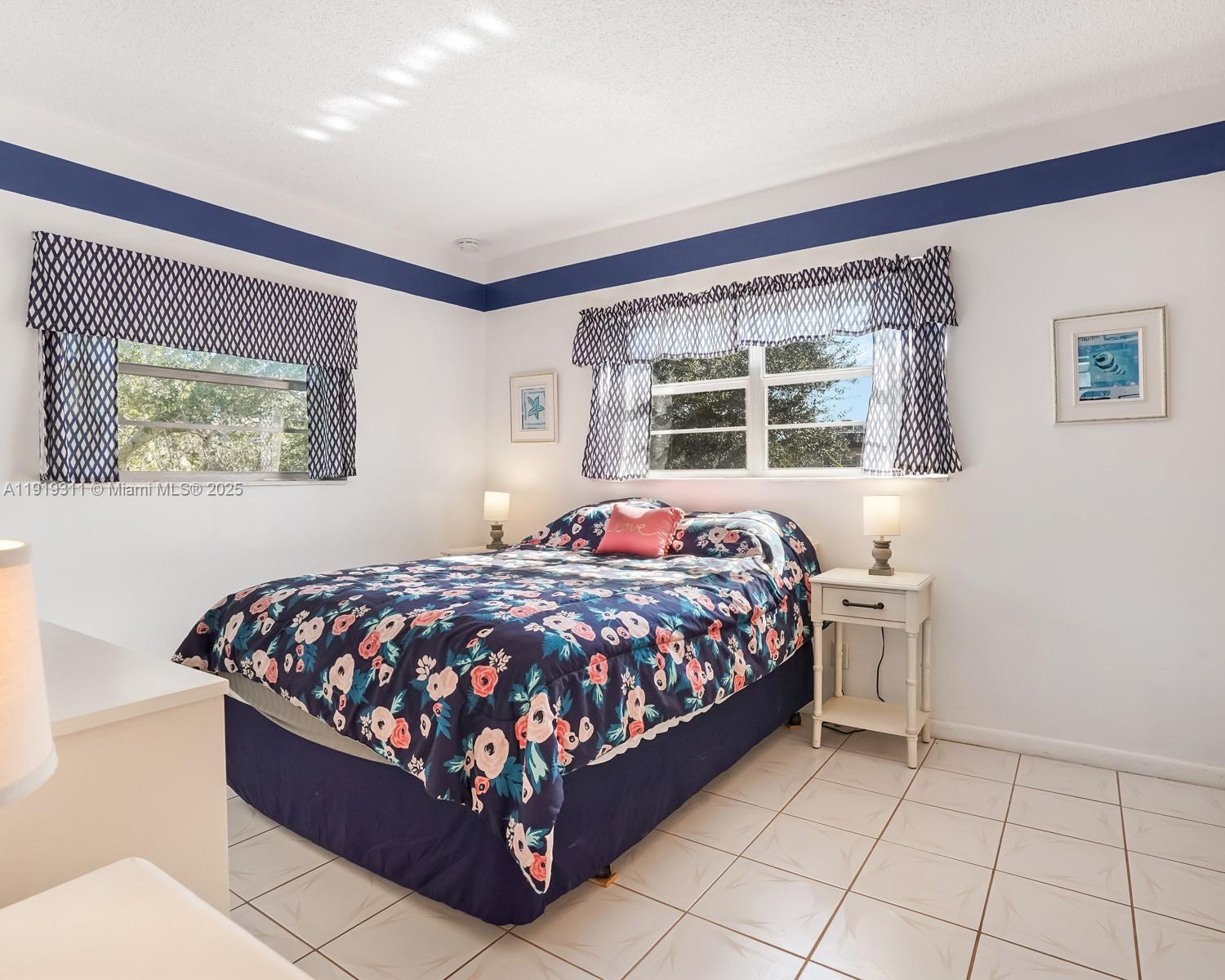 4705 Northwest 35th Street, Unit 616 Lauderdale Lakes, FL 33319 - Photo 12 of 33 a bedroom with a bed and window