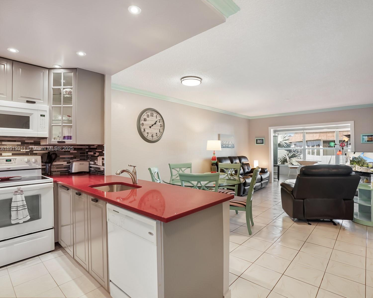 4705 Northwest 35th Street, Unit 616 Lauderdale Lakes, FL 33319 - Photo 2 of 33 a kitchen with stainless steel appliances granite countertop a sink and cabinets
