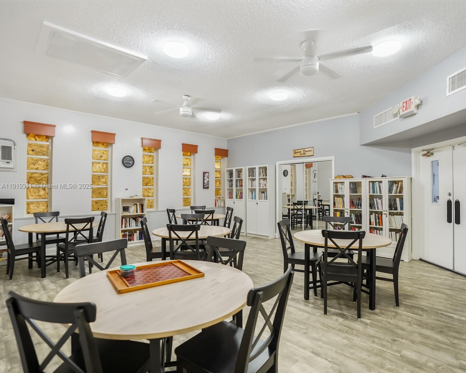 4705 Northwest 35th Street, Unit 616 Lauderdale Lakes, FL 33319 - Photo 27 of 33 a view of a dining room with furniture window and wooden floor