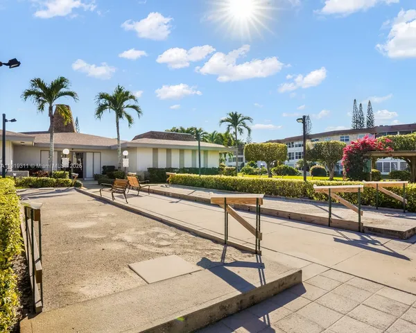 a view of a swimming pool with outdoor seating