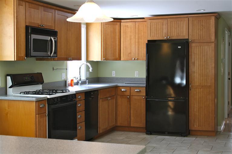 127 Suomi Road Hyannis, MA 02601 - Photo 3 of 15 a kitchen with a refrigerator and a sink