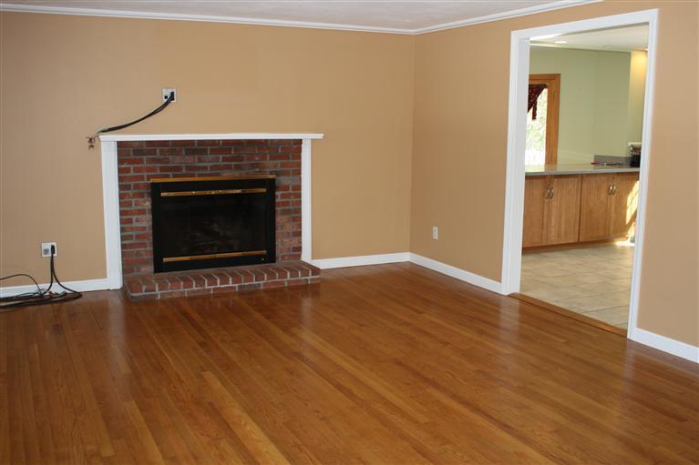 127 Suomi Road Hyannis, MA 02601 - Photo 4 of 15 wooden floor fireplace and natural light