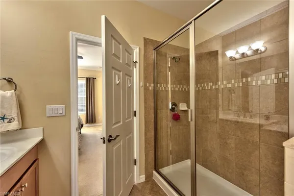 a bathroom with a shower and a sink