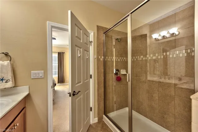 a bathroom with a shower and a sink
