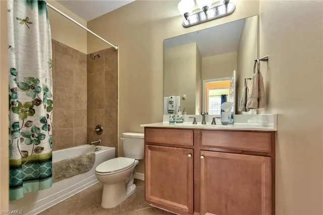 a bathroom with a toilet a sink and a mirror