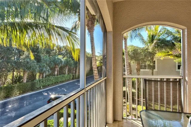 a view of balcony with yard