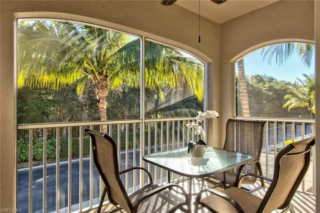 a view of a chair and table in the balcony