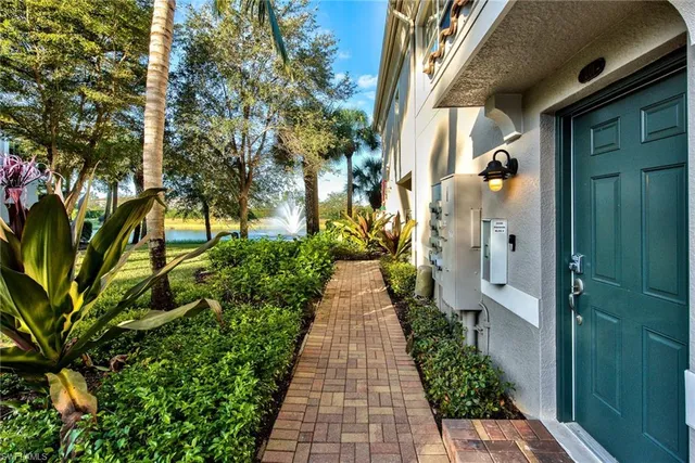 a view of a pathway both side of the house