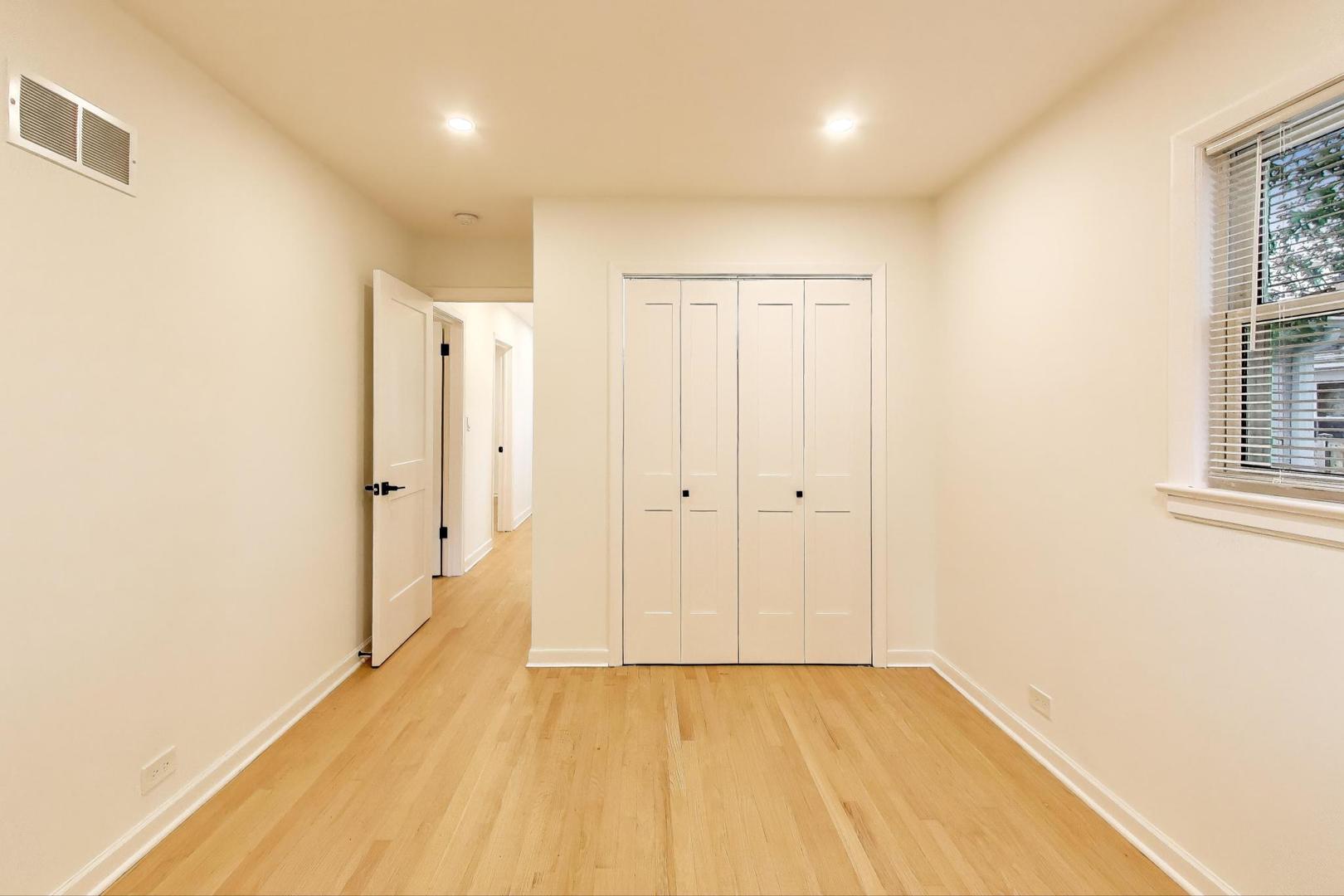832 North Delphia Avenue Park Ridge, IL 60068 - Photo 13 of 29 a view of a hallway with wooden floor and a bathroom