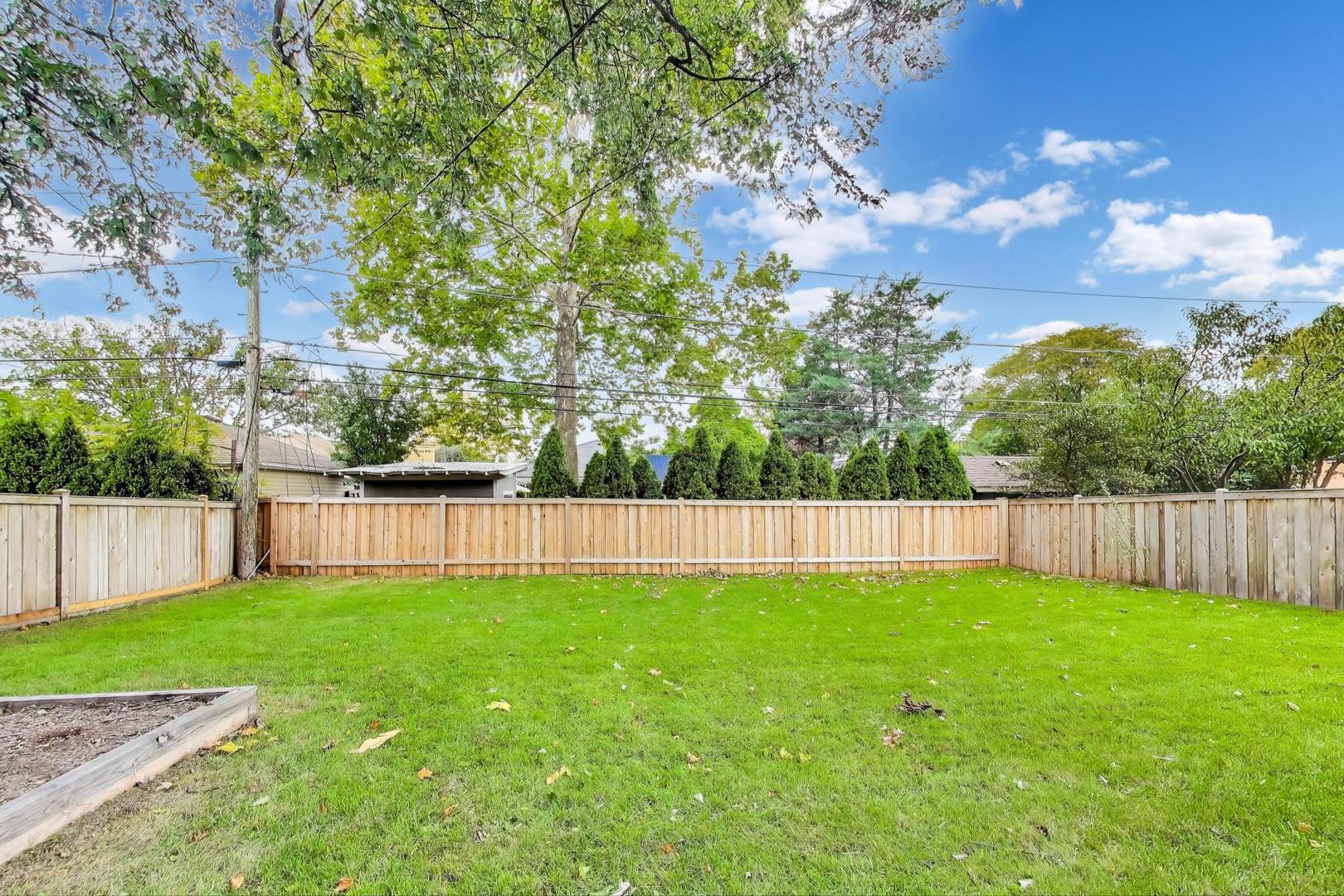 832 North Delphia Avenue Park Ridge, IL 60068 - Photo 27 of 29 a view of a backyard with a large trees