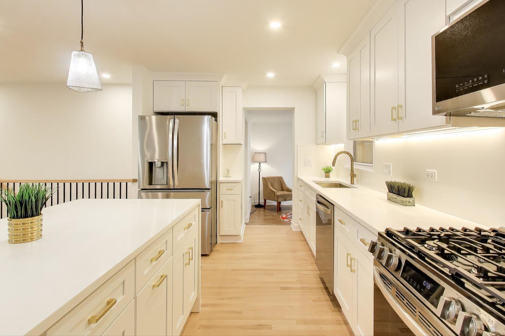 832 North Delphia Avenue Park Ridge, IL 60068 - Photo 5 of 29 a kitchen with a stove and a wooden floor