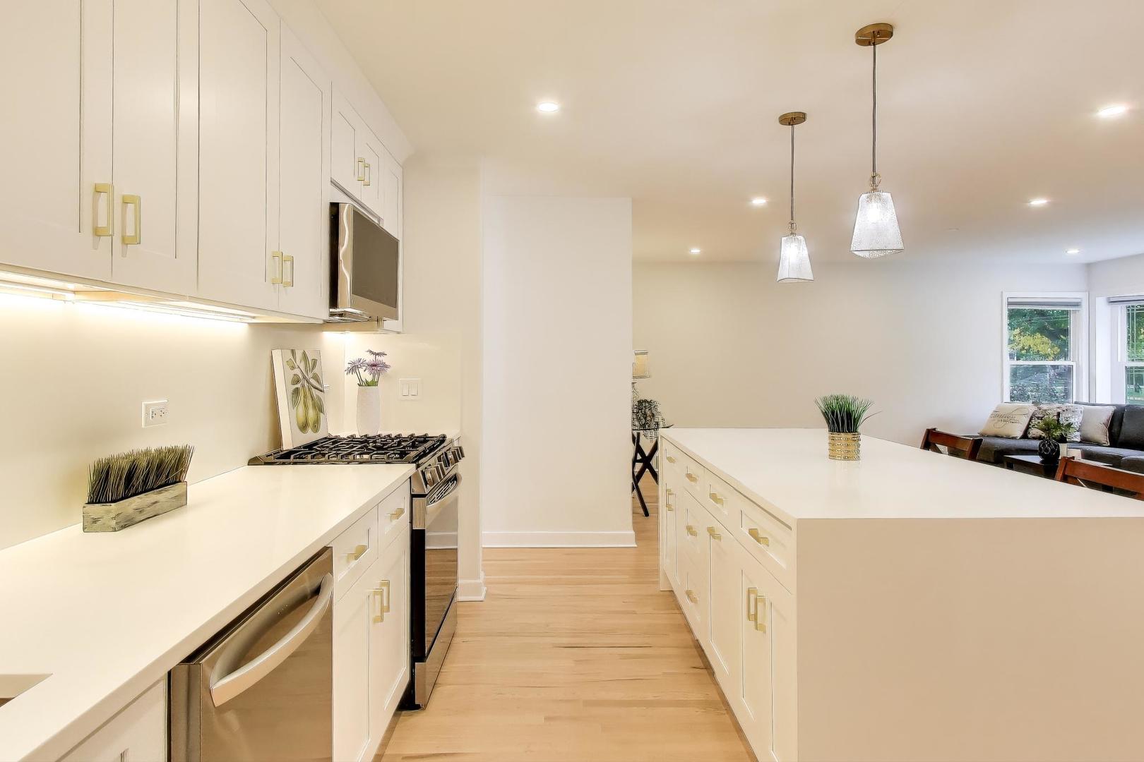 832 North Delphia Avenue Park Ridge, IL 60068 - Photo 6 of 29 a kitchen with a sink a stove and a refrigerator