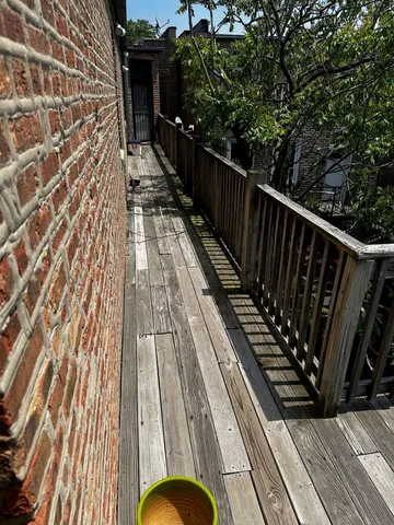 a balcony with wooden floor