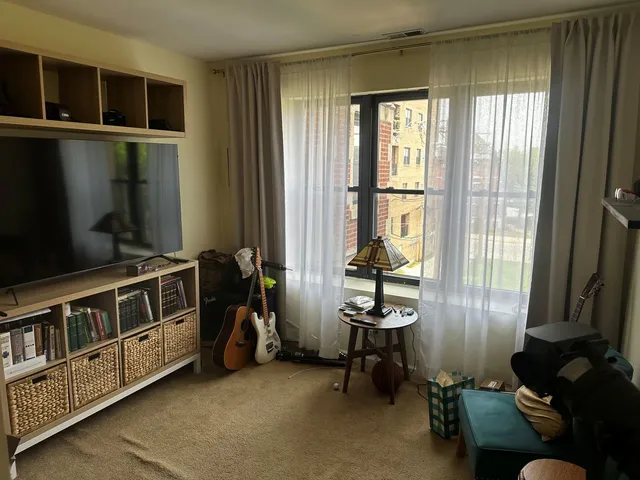 a view of a room with workspace and windows