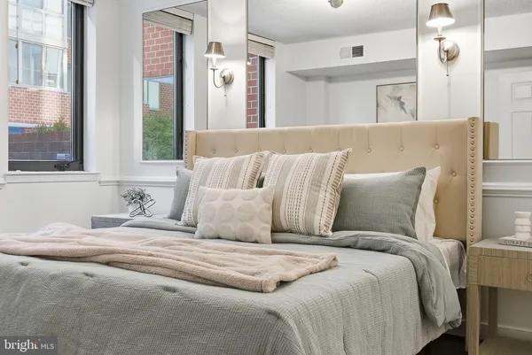 a large white bed in a white room