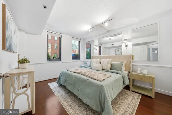 a bed room with a bed and a chair