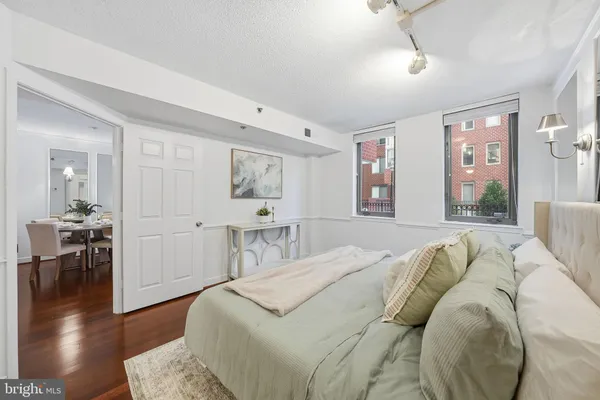 a bed room with a bed and a television