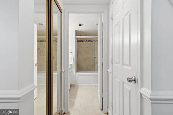 a view of a bathroom from a hallway