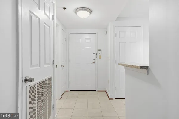 a view of a hallway with closet area
