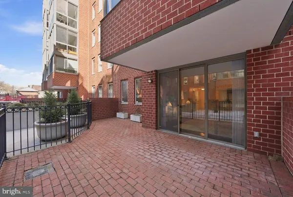 a balcony view with a glass door