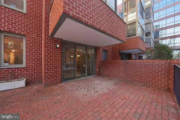 a view of a house with brick walls
