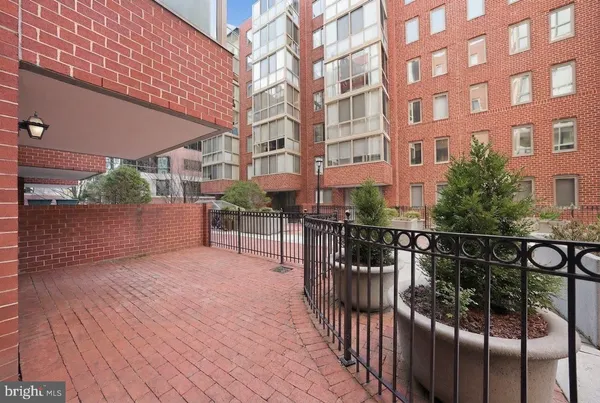 a view of a brick building from a balcony