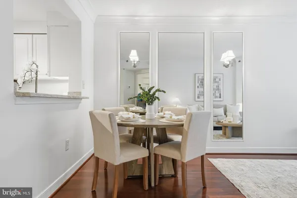 a view of a dining room with furniture and wooden floor