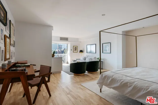 a bedroom with a bed and a table in it