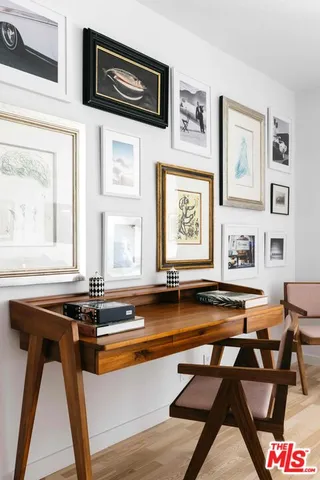 a view of a kitchen with table and chairs