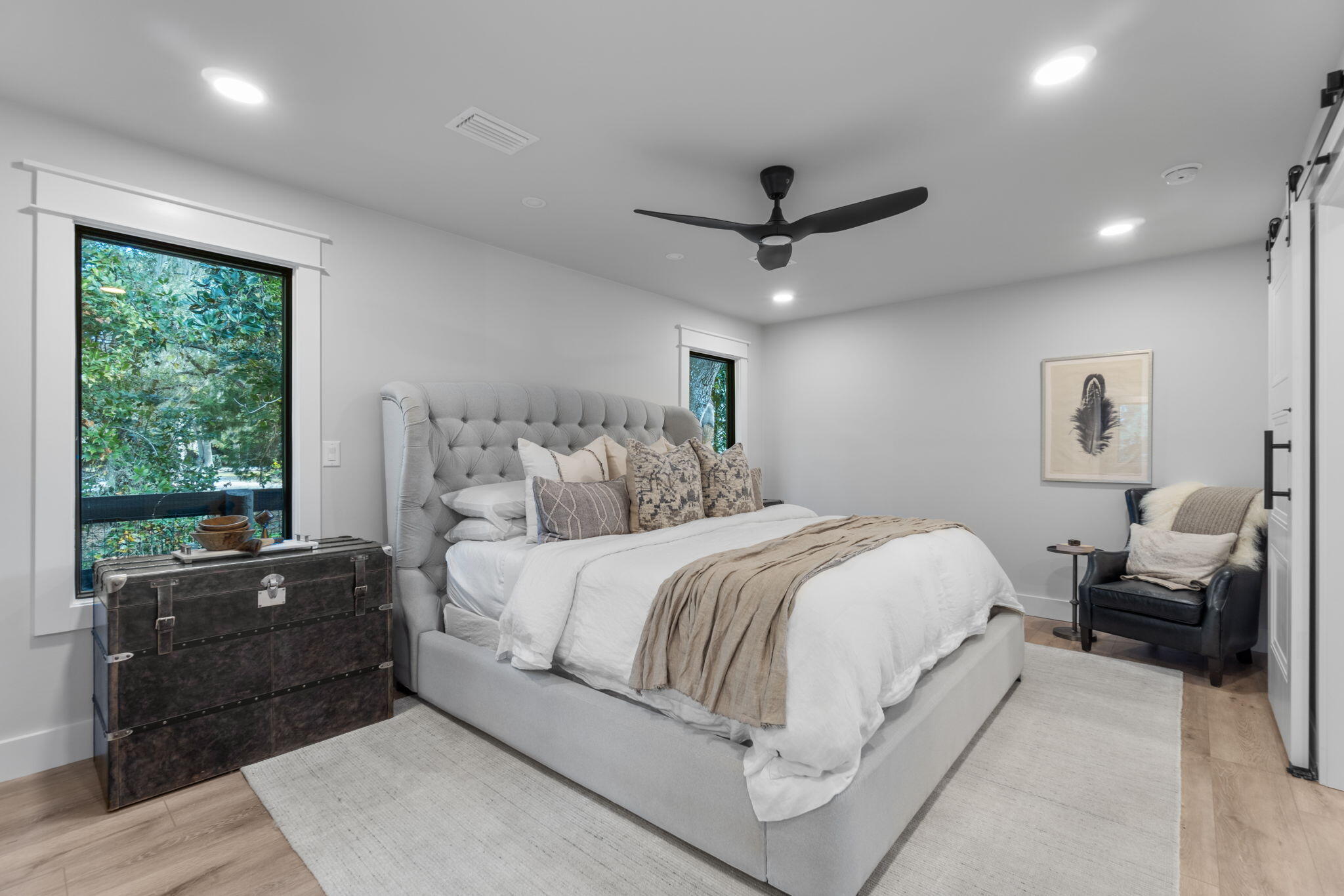 7423-7433 Highway 20 Freeport, FL 32439 - Photo 21 of 69 a spacious bedroom with a bed a couch and a window