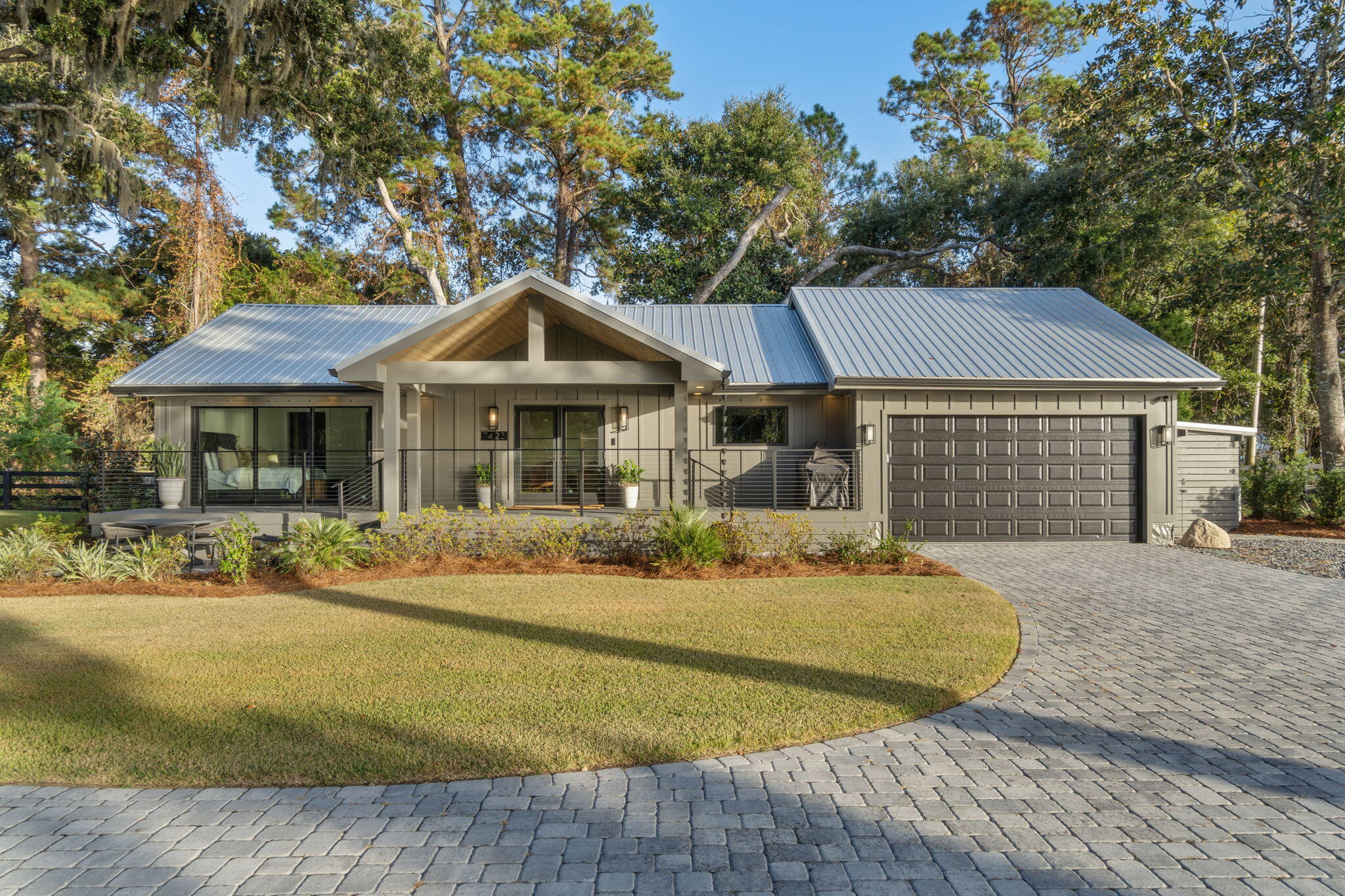 7423-7433 Highway 20 Freeport, FL 32439 - Photo 4 of 69 a front view of a house with garden