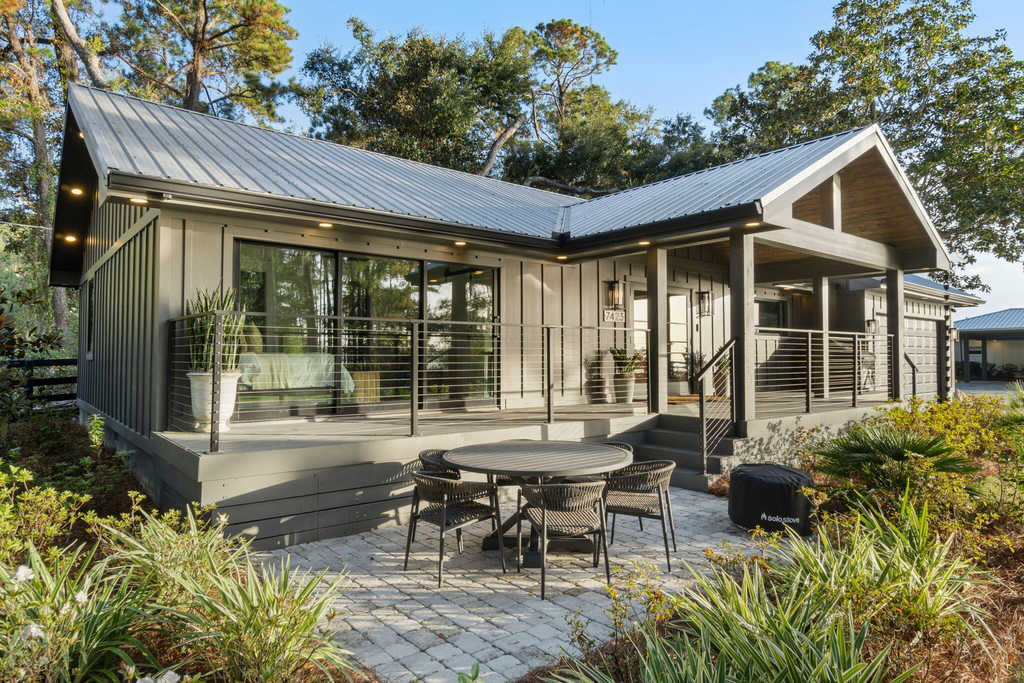 7423-7433 Highway 20 Freeport, FL 32439 - Photo 5 of 69 a view of a house with backyard sitting area and garden